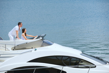Fototapeta na wymiar young couple on yacht