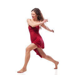 Young ballet dancer wearing red dress isolated