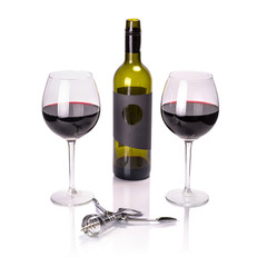 Red wine in glasses with bottle and corkscrew over white