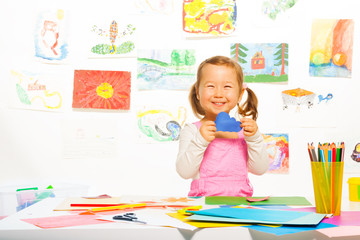 Little girl with paper cloud