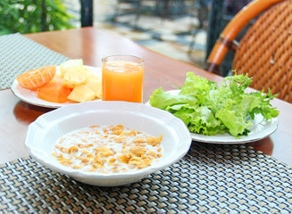 Breakfast with cornflakes, vegetables and fruits