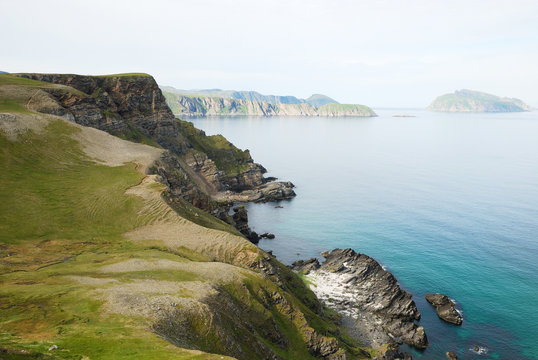 Steep shore of Soroya in summer