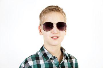 Smiling boy in sunglasses. Youth fashion.