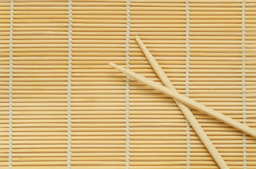 Sticks on wooden background.