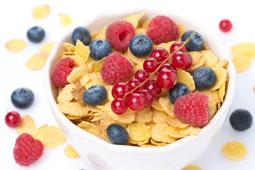 bowl of cornflakes and fresh berries, top view