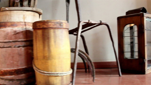 Three wooden barrels and an old lamp