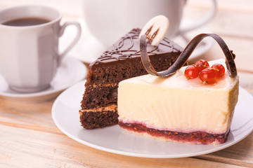 delicious chocolate and cheesecake with cup of coffee