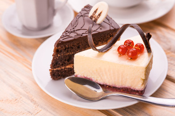 delicious chocolate and cheesecake with cup of coffee