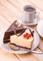 delicious chocolate and cheesecake with cup of coffee