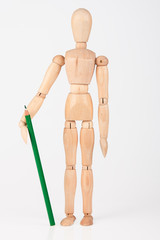Small wood mannequin standing with colour pencil isolated on whi