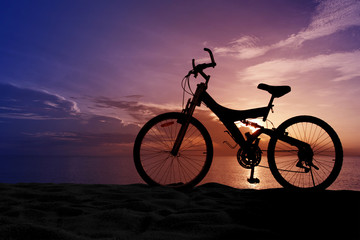 Fototapeta premium Silhouette of a Bike on the Beach