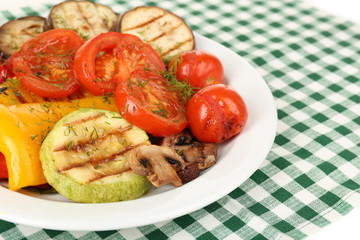 Delicious grilled vegetables on plate on table close-up