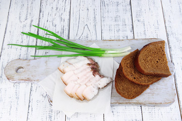 Slices of bread and lard with onion