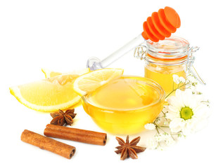 Sweet honey with lemon and cinnamon isolated on white