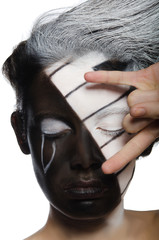 woman with musical face art and rock gesture