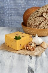 Tasty Italian cheese and bread on wooden table