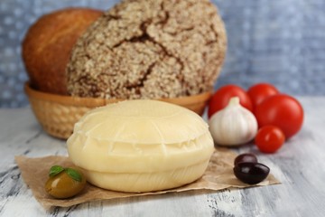 Tasty Italian cheese on wooden table