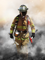 Naklejka premium A firefighter pierces through a wall of smoke