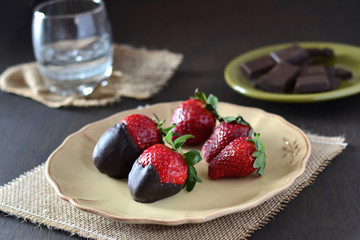 Chocolate strawberries on dark background