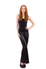 Fototapeta premium Redhead woman in black bell bottom pants on white