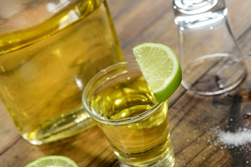 Tequila shoot with lemon slice up