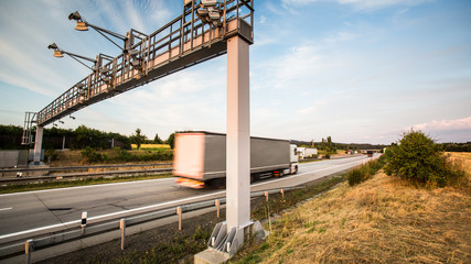 truck passing through a toll gate on a highway