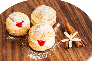 Homemade profiteroles with cream and crimson curd