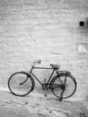 Old Bike against wall in black and white