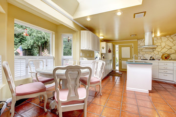 Ivory and white kitchen room with dining table set