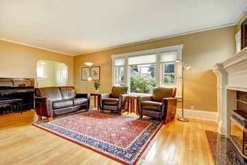 Elegant living room with leather furniture set.