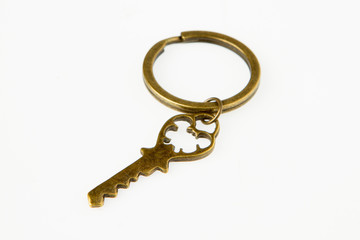 A golden key on white background