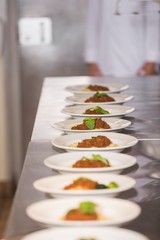 Cooked food in a row on kitchen counter