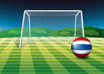 A ball at the field with the flag of Thailand