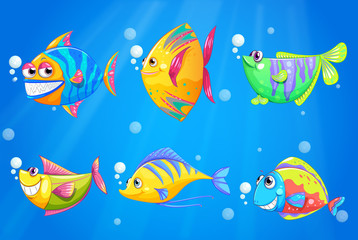 Naklejka premium Colorful and smiling fishes under the sea