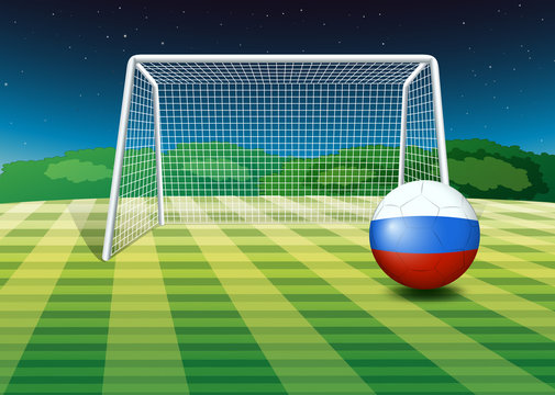 A soccer ball near the net with the flag of Netherlands