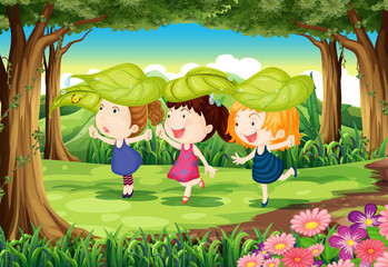Three playful kids at the forest