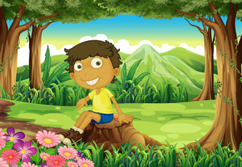 Obraz na płótnie Canvas A smiling child sitting above the stump