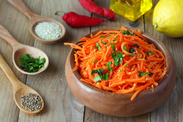 Korean-style spicy carrot salad with coriander and sesame seeds