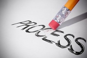 Pencil erasing the word Process