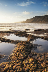Beautiful ocean landscape image during stunning sunset
