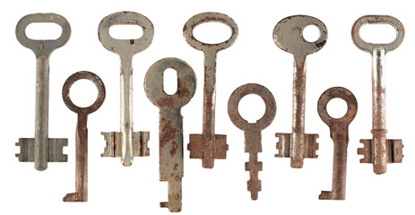 Set of old keys from door locks isolated on white background.