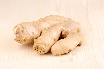 Ginger on wooden background