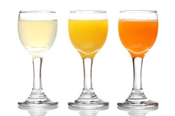Tropical juices in glasses isolated on white