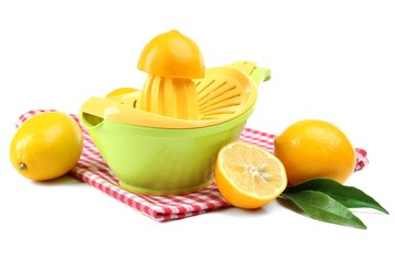 Citrus press and lemons isolated on white