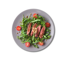 chopped beef steak medium, Ruccola salad, walnuts,plate,isolated