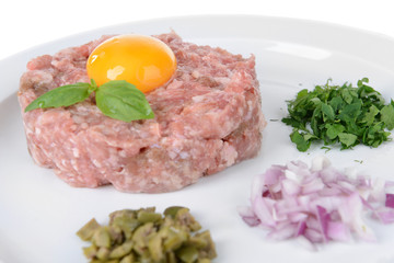 Fototapeta premium Delicious steak tartare with yolk on plate close-up
