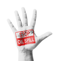Open hand raised, Stop Oil Spill sign painted