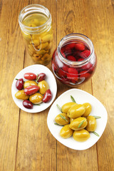 Tasty olives on wooden table
