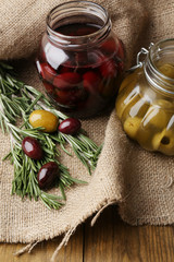 Tasty olives on wooden table