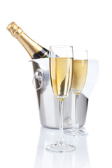 Glasses of champagne in pail, isolated on white
